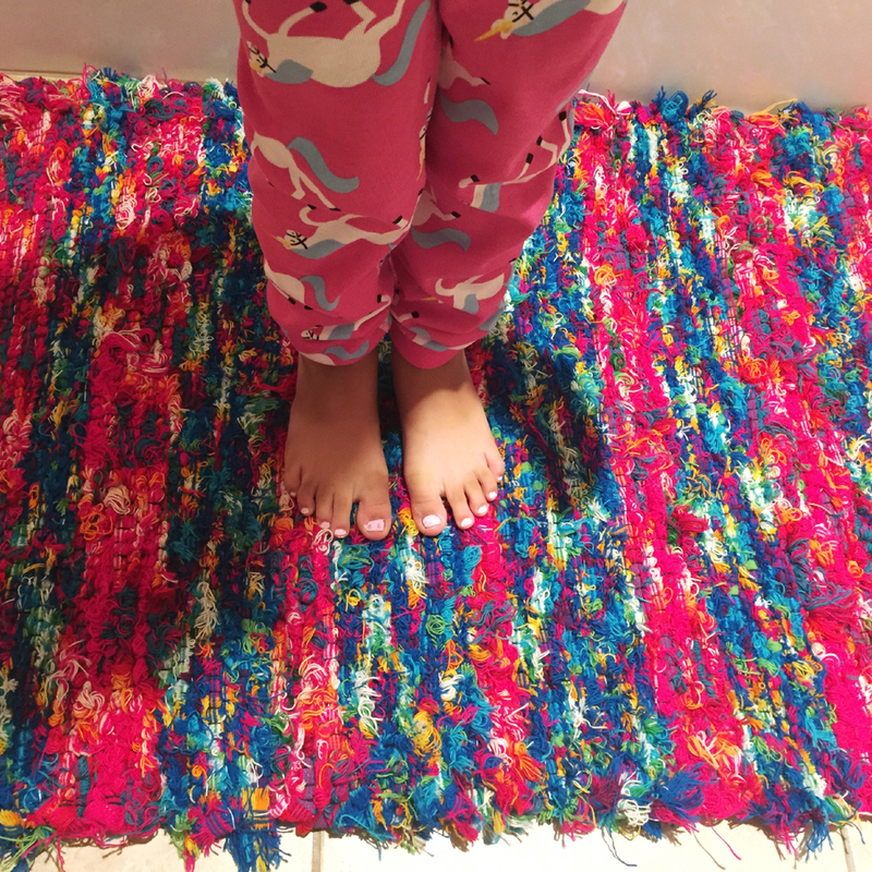 "This little one is genuinely grateful for Kathy’s rug, a comfortable, warm place for these small feet. At a young age, the kid already has an appreciation for the fine craft of a local artisan." -Dawn B.